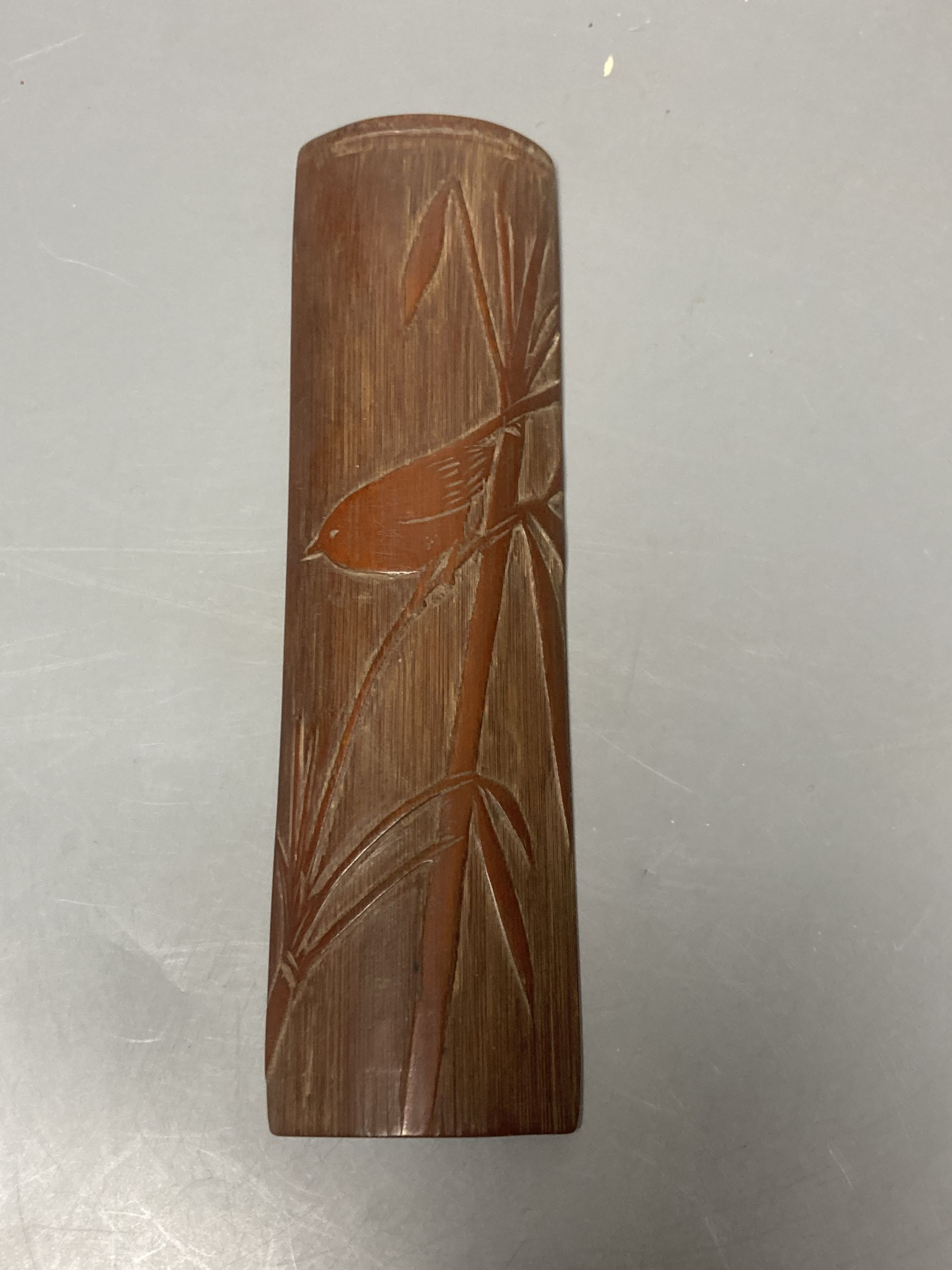 A Japanese bamboo wrist wrest, a Chinese jadeite, bamboo scoop and wooden carving possibly Zitan, 19th century etc.
